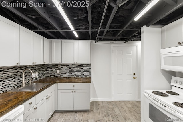 120 Seward St Unit U2, Detroit, MI 48202 - kitchen featuring white appliances, butcher block countertops, white cabinets, and tasteful backsplash