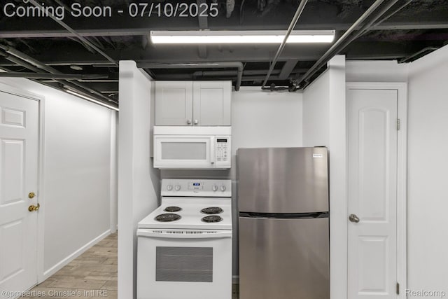 120 Seward St Unit U2, Detroit, MI 48202 - kitchen featuring white appliances, light wood-style floors, and white cabinetry