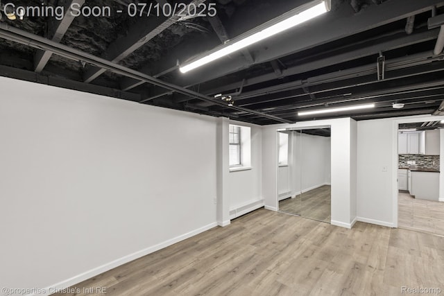 120 Seward St Unit U2, Detroit, MI 48202 - below grade area with wood finished floors and baseboards