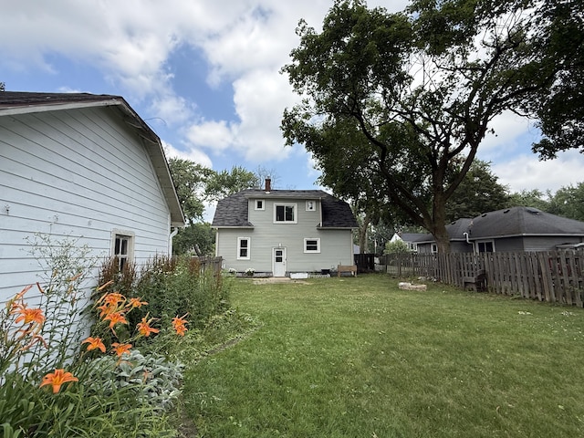 1316 Vassar Dr, Kalamazoo, MI 49001 - back of house with a shingled roof