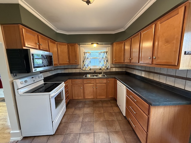 1316 Vassar Dr, Kalamazoo, MI 49001 - kitchen with white appliances, brown cabinetry, dark countertops, tasteful backsplash, and ornamental molding