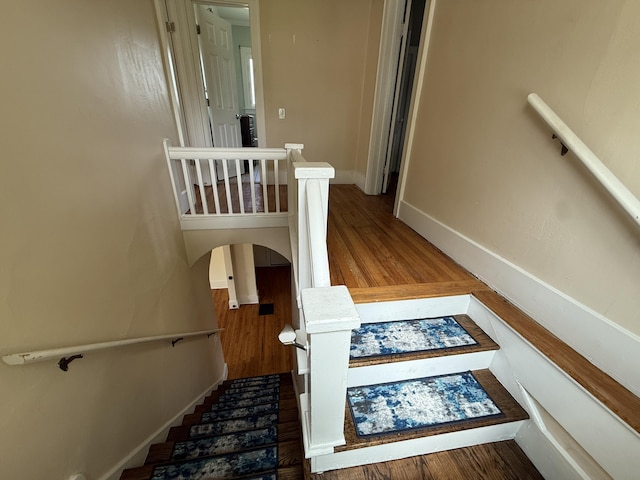 1316 Vassar Dr, Kalamazoo, MI 49001 - staircase featuring baseboards and wood finished floors