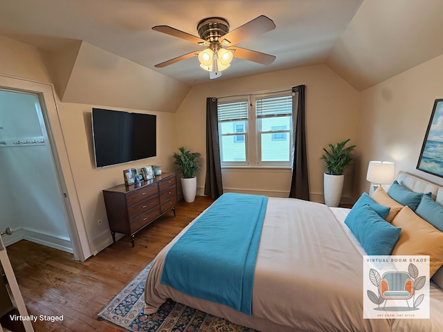 1316 Vassar Dr, Kalamazoo, MI 49001 - bedroom featuring lofted ceiling, wood finished floors, and a ceiling fan