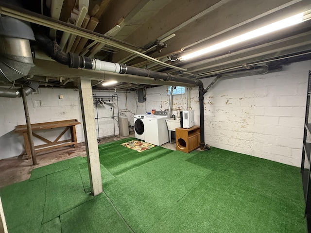 1316 Vassar Dr, Kalamazoo, MI 49001 - unfinished basement with independent washer and dryer and a sink