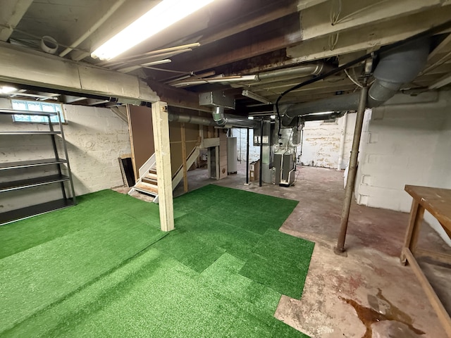 1316 Vassar Dr, Kalamazoo, MI 49001 - unfinished below grade area featuring stairs and gas water heater