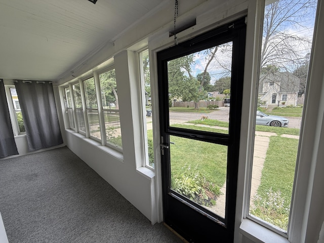 1316 Vassar Dr, Kalamazoo, MI 49001 - unfurnished sunroom featuring plenty of natural light and carpet