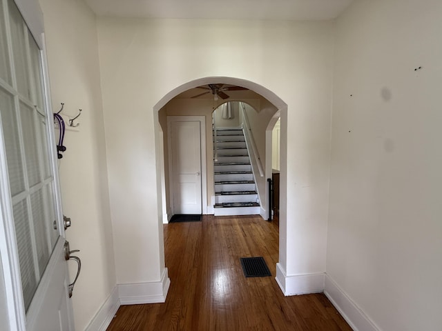1316 Vassar Dr, Kalamazoo, MI 49001 - corridor featuring wood finished floors, stairway, and arched walkways