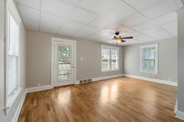 716 17th St, Jackson, MI 49203 - empty room with light wood-style flooring, healthy amount of natural light, and ceiling fan