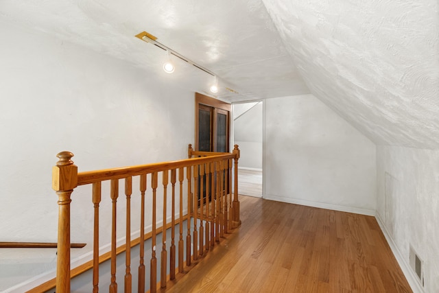 716 17th St, Jackson, MI 49203 - bonus room featuring wood finished floors and vaulted ceiling