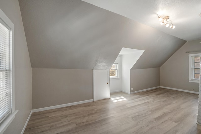 716 17th St, Jackson, MI 49203 - additional living space featuring light wood finished floors and lofted ceiling