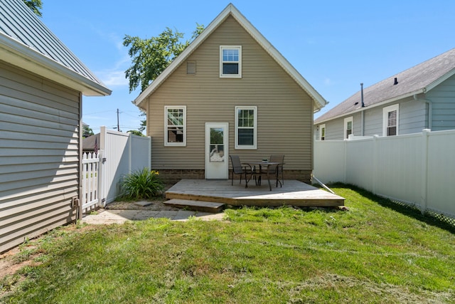 716 17th St, Jackson, MI 49203 - rear view of house with a deck and a fenced backyard