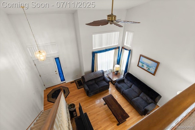 3070 10th St, Monroe, MI 48162 - living area with a high ceiling, ceiling fan, and wood finished floors
