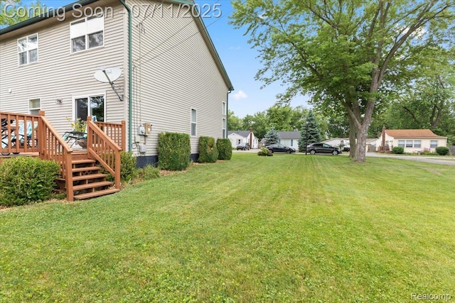 3070 10th St, Monroe, MI 48162 - view of side of home featuring a yard and a deck