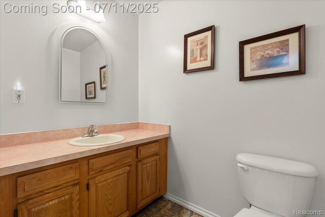 3070 10th St, Monroe, MI 48162 - half bathroom with vanity and stone finish floors