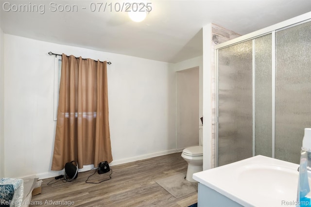 15326 Brookfield St, Livonia, MI 48154 - bathroom featuring wood finished floors, a stall shower, and vanity