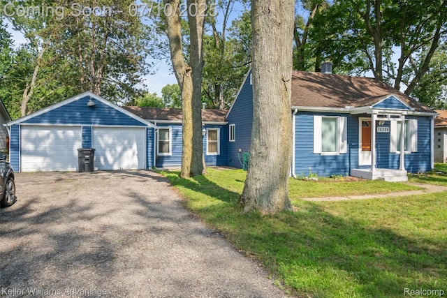 15326 Brookfield St, Livonia, MI 48154 - view of front of home featuring a front lawn, a garage, and driveway