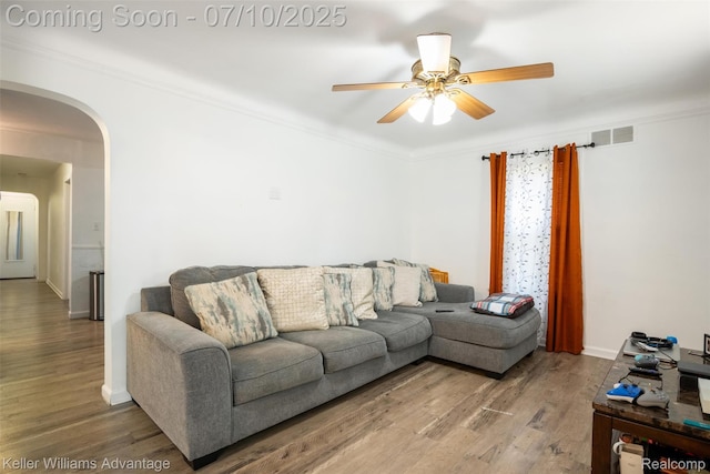 15326 Brookfield St, Livonia, MI 48154 - living room with arched walkways, ceiling fan, wood finished floors, and ornamental molding