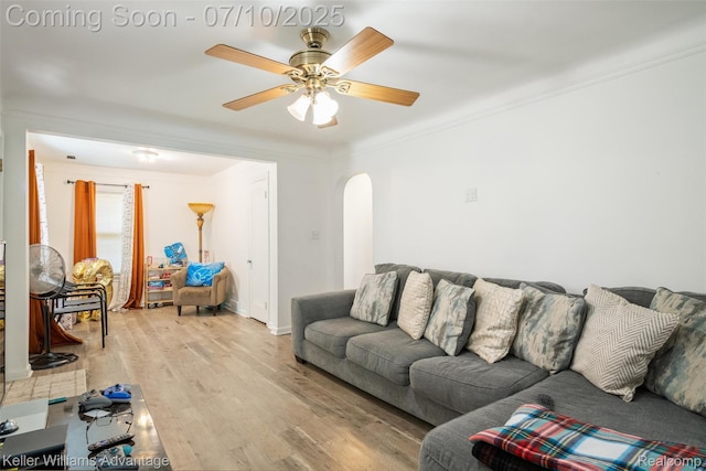15326 Brookfield St, Livonia, MI 48154 - living area with arched walkways, ornamental molding, light wood-style floors, and a ceiling fan