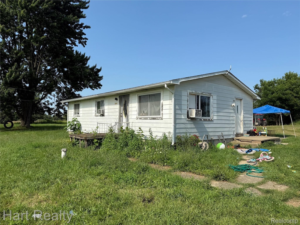 3571 Sandusky Rd, Peck, MI 48466 - rear view of house with a lawn