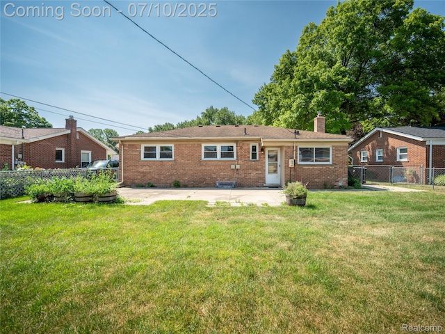 35622 Minton St, Livonia, MI 48150 - view of front of home with a chimney, brick siding, and a patio area