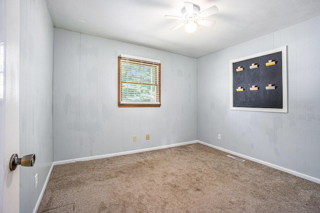 15645 Rich Ln, Hickory Corners, MI 49060 - unfurnished room featuring a ceiling fan and carpet flooring