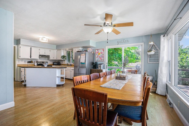 15645 Rich Ln, Hickory Corners, MI 49060 - dining room with light wood-style flooring and a ceiling fan