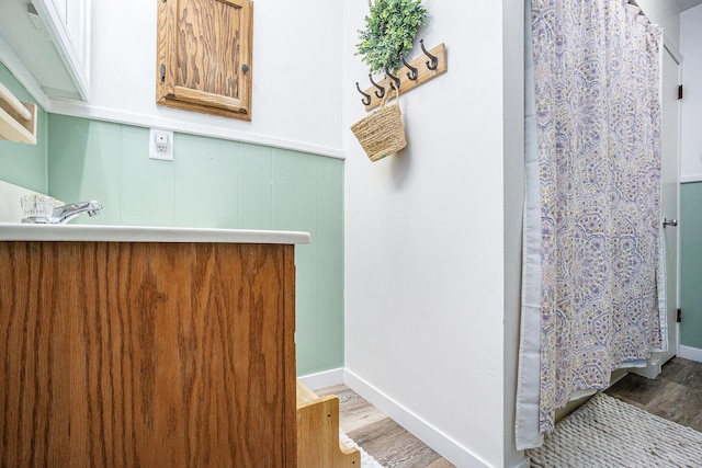 15645 Rich Ln, Hickory Corners, MI 49060 - bathroom with wood finished floors and a shower with curtain