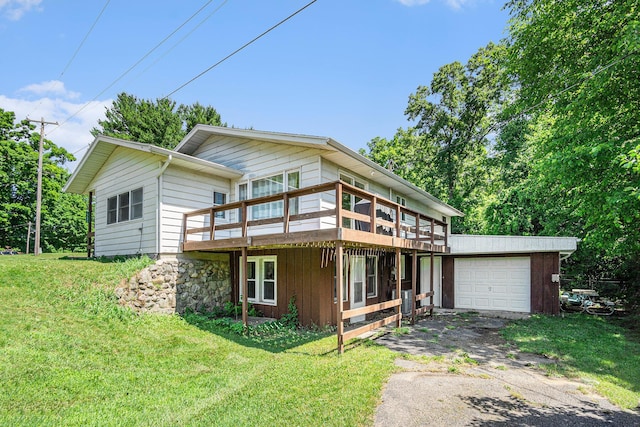 15645 Rich Ln, Hickory Corners, MI 49060 - view of front facade with driveway, a garage, a front lawn, and a deck
