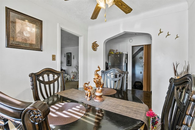 19359 Montrose St, Detroit, MI 48235 - dining area featuring arched walkways, a ceiling fan, and a textured ceiling