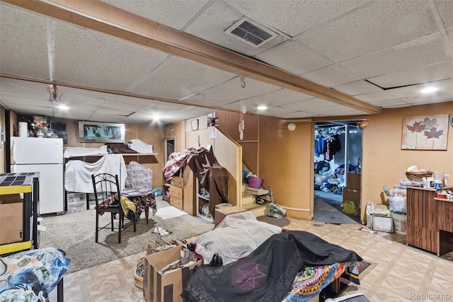 19359 Montrose St, Detroit, MI 48235 - finished below grade area with a drop ceiling and freestanding refrigerator