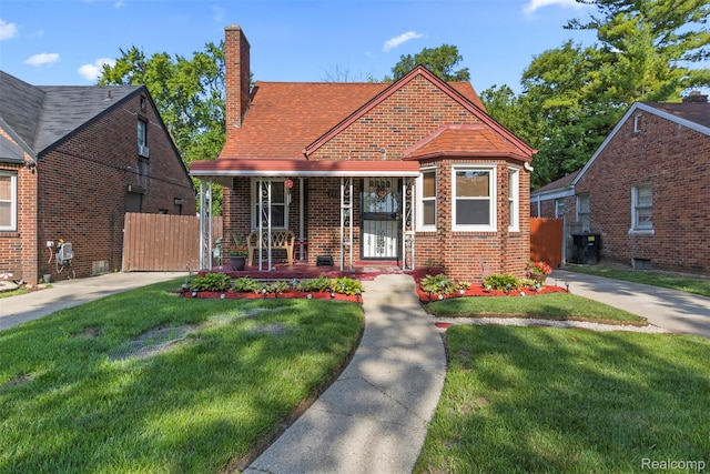19359 Montrose St, Detroit, MI 48235 - bungalow with a chimney, a porch, and brick siding
