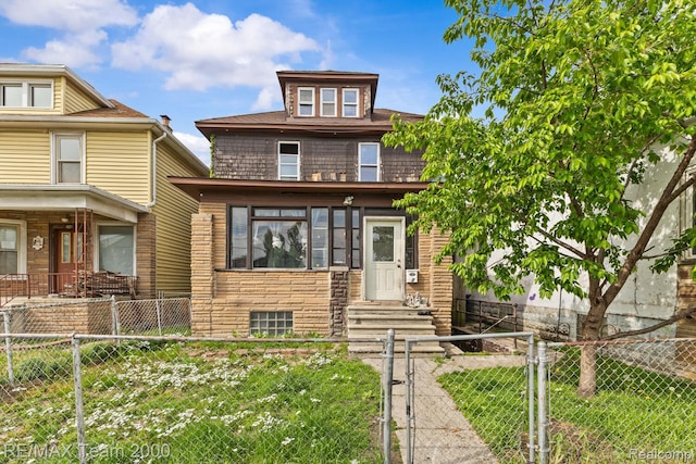 22 W Henry St, River Rouge, MI 48218 - american foursquare style home featuring a fenced front yard and a gate