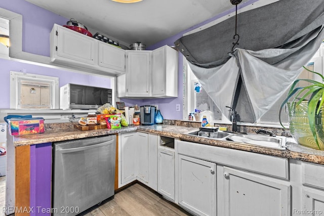 22 W Henry St, River Rouge, MI 48218 - kitchen featuring dishwasher, white cabinetry, and light wood finished floors