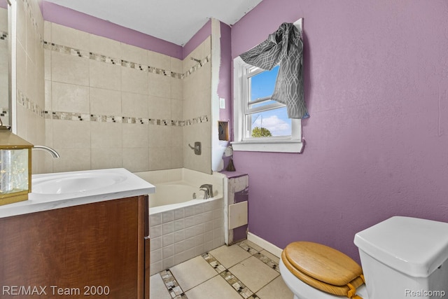 22 W Henry St, River Rouge, MI 48218 - bathroom with tiled tub, vanity, and tile patterned flooring