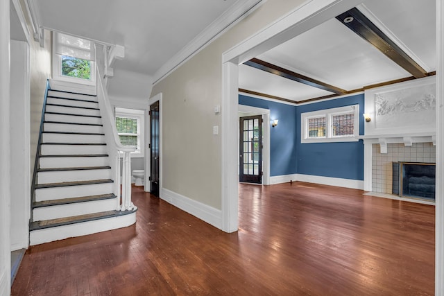 1227 Longfellow St, Detroit, MI 48202 - unfurnished living room featuring crown molding, wood finished floors, stairway, and a fireplace