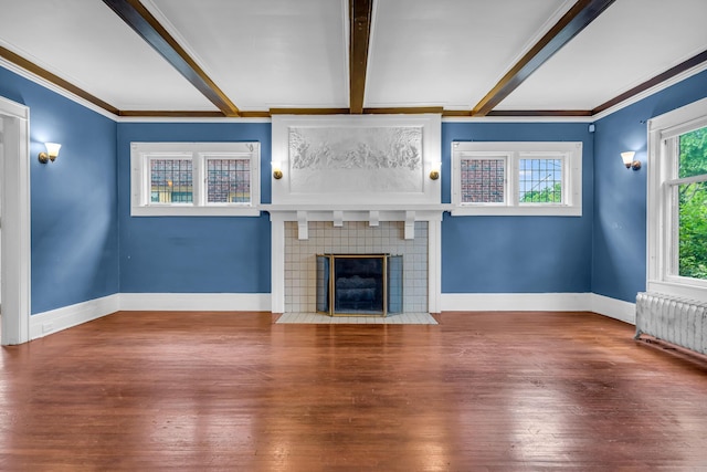 1227 Longfellow St, Detroit, MI 48202 - unfurnished living room featuring radiator, beamed ceiling, wood finished floors, ornamental molding, and a tile fireplace