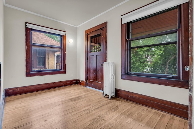 1227 Longfellow St, Detroit, MI 48202 - foyer entrance featuring radiator, crown molding, and wood finished floors