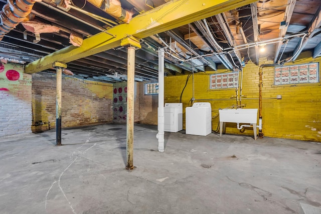 1227 Longfellow St, Detroit, MI 48202 - basement featuring washing machine and clothes dryer and brick wall