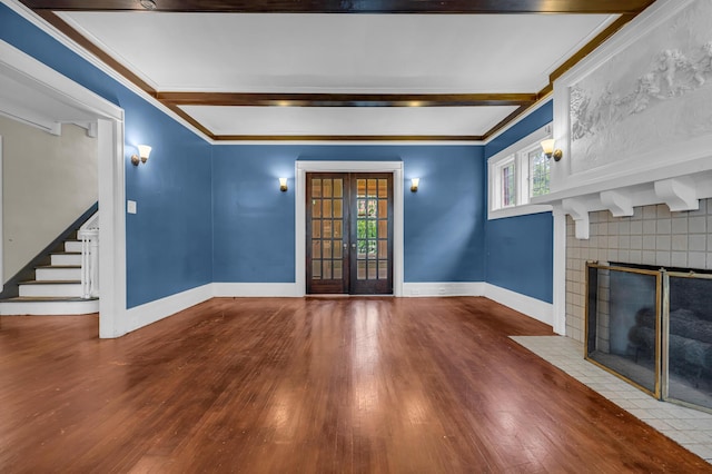 1227 Longfellow St, Detroit, MI 48202 - unfurnished living room featuring a tile fireplace, wood finished floors, healthy amount of natural light, beam ceiling, and crown molding