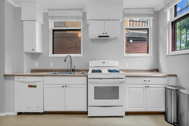1227 Longfellow St, Detroit, MI 48202 - kitchen with white appliances, white cabinets, and light tile patterned floors