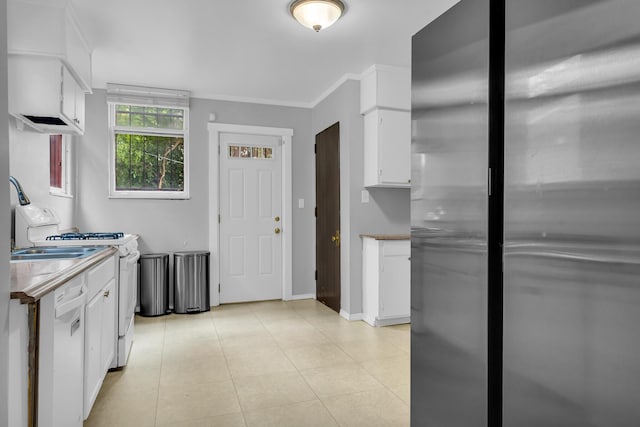 1227 Longfellow St, Detroit, MI 48202 - kitchen with white appliances, white cabinets, crown molding, light tile patterned flooring, and light countertops