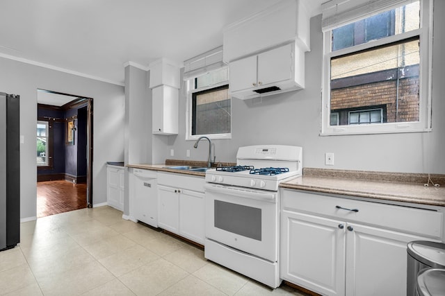 1227 Longfellow St, Detroit, MI 48202 - kitchen featuring white appliances, white cabinets, crown molding, and light tile patterned floors