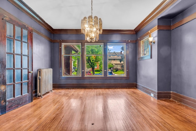 1227 Longfellow St, Detroit, MI 48202 - unfurnished dining area featuring radiator, ornamental molding, a chandelier, and wood-type flooring