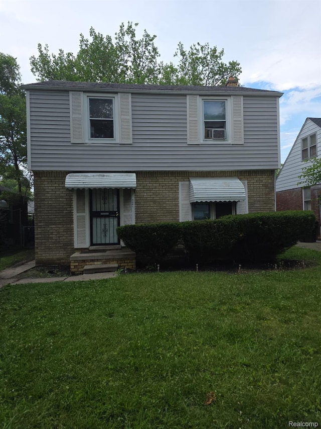 20460 Appoline St, Detroit, MI 48235 - colonial inspired home with brick siding, a front yard, and cooling unit