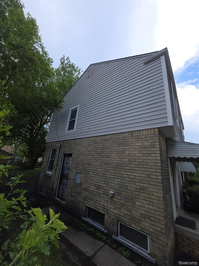 20460 Appoline St, Detroit, MI 48235 - view of side of home featuring brick siding