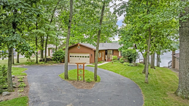 263 Westshore Dr, Jerome, MI 49249 - ranch-style home with driveway, a garage, a front lawn, and roof with shingles