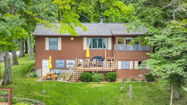 263 Westshore Dr, Jerome, MI 49249 - rear view of house with roof with shingles, a lawn, a deck, and stairs