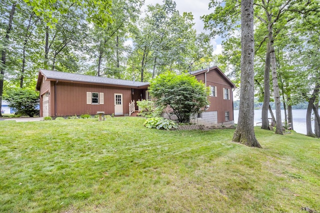 263 Westshore Dr, Jerome, MI 49249 - rear view of house with a yard and a water view
