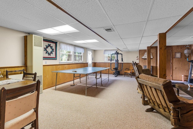 263 Westshore Dr, Jerome, MI 49249 - game room with wood walls, a heating unit, a drop ceiling, and wainscoting
