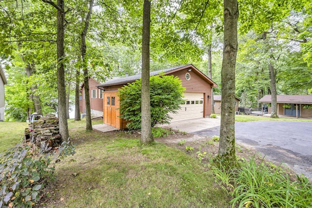 263 Westshore Dr, Jerome, MI 49249 - view of side of home with an outbuilding and a garage